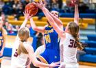 Kenadi Arndt (10) scores two of her team-high 21 points against YME Monday night. 