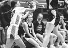 Brynn Rost, right, of Minneota tries to prevent a Yellow Medicine East player from inbounding the ball on Friday night in Minneota. 