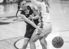 Nevaeh Hennen (1) of Minneota fires a pass around Pipestone’s Keera Pottratz last Tuesday evening in Minneota 