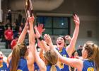The Minneota girls celebrate after receiving their Section 3A championship trophy. Left to right: McKenzie Tolk, Natalee Rolbiecki, McKenna Yost, Ireland Stassen and Jeren Rost. 