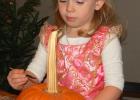 Alaina Kellen, 3, of Marietta was here visiting relatives and painted a pumpkin during Harvest Festival at City Hall Bar & Grill. 