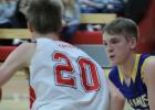 Minneota's Riley Buysse closely guarded Westbrook-Walnut Grove's Hunter Lien.