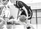 Ian Myhre of the Vikings looks to drive against Pipestone Monday night in Minneota.
