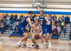 Jacob Citterman and Logan Sussner defend YME point guard Elliot Korstad.
