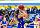 Jeren Rost took a shot for Minneota with YME's Emily Johnson on the right and Viking Madison Sorenson on the left.