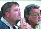 Mayor John Rolbiecki (left) and Councilman Jerry Teigland listened to the audience.