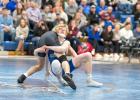 Jonah Gruenes works towards a takedown. Gruenes has advanced to the semi-finals. 