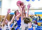 Joseph Rybinski put the ball toward the basket as he was surrouded by RTR opponents.
