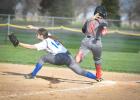 Katie Konold stretches out at first base to get the Eagles' runner out. 