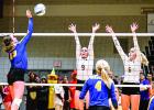 Photo by Brian Jeremiason. Jennifer Krog batted the ball past Wabasso defenders Jenna Franka (9) and Amanda Hoffman (6). Lizzy Gillingham watched (center) with Rachel Vlaminck on the right.