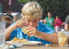Kyle Thooft of Tyler used a dunking method to win the 17-and-under Waffle Eating Contest as part of Belgian-American Days on Saturday in Ghent. Thooft, who soaked his waffles in water before eating them, consumed nearly four large Belgian waffles in five minutes to win his age group. Levi Vierstraete was the men's winner and Mary Revel was the women's winner. 
