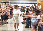 Dero is congratulated on her career by students and staff on her last day of teaching last week. 