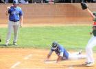 Bryce Jergenson of Morris scores as Mudhens pitcher takes the throw late from catcher Austin DeVlaeminck. Mac Beyer of Morris looks on. 