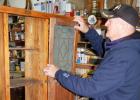 Markell works on putting in one of the glass doors on the Hoosier cabinet he is currently working on. 