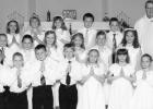 The First Communion at St. Edward Church held on April 25, 2010. Front row, left to right: Riley Buysse, Victor Petersen, Cole Sanow, Avery DeVlaeminck, Madison Sorensen, Cecilia Rabaey, Paige Welsh. Second row, left to right: Anthony DeSmet, Merissa Traen, Cheyenne Moorse, Natalie Bot, Ali DeVlaeminck, Katie Konold. Back row, left to right: Rachel Vlaminck, Hannah Brewers, Tara Thooft, Logan Sussner, Grady Moorse, Father Jeremy Kucera.