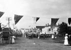Minneota community members celebrate the Fourth of July along First Street in 1910.