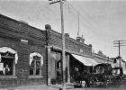 A Minneota businessman looks out his window on Jefferson Street looking north in this photo taken in 1901.