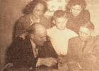 In this photo taken on Sept. 25, 1950, Medard Debbaut, seated at left, is showing a rare stamp to Billy Holm, age 7, center, and E.F. Leland, seated right. Standing in the back is Mrs. Wendell Anderson and Mrs. William Holm. The group met at the Joy Theatre with the idea of starting a stamp club.