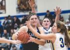 Morgan Hennen and Jeren Rost defend Lakeview center Shelby Gravley.