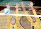 Staff Photo by Byron Higgin Morgan Hennen *left) and Lydia Sussner blocked the ball against Yellow Medicine East.