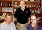 Brad and Courtney Norcutt will be taking over as owners of Rusty's Corner Café on Jan. 1. Rusty Rhymer, standing, has owned the business the last 30 years. The new café will be called Duke's Corner Café. 