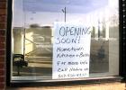 Sign announces the coming of a new store in Minneota. 