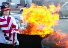 Pam Gregor helped burn the used flags.