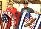 Allan Dovre, left, and John DeSmet, both of Minneota, were presented with a Quilt of Valor on Saturday.