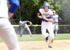 Minneota's Sam Buysse was running for this as if his feet were on fire. He got there and scored Minneota's first run of the game on a single by Teddy Pesch. Lakeview centerfielder Aaron Leinemann picked up the ball after Pesch's hit.
