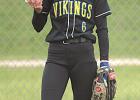 Minneota/Canby left fielder Emily Walker tried to stay warm during a softball game against Kerkhoven-Murdock-Sunburg Saturday morning in 40-degree weather in Minneota. The Vikings won the game, 6-4. 