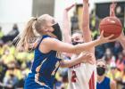 Abby Rost drives to the basket to score two of her nine points against Houston on Tuesday in Mankato. 