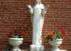 This historic 62-inch statue sits outside St. Edward’s Catholic School beside the church. It has deteriorated over time due to the elements and now parishioners are attempting to raise money to have it repaired. Mascot photo by Scott Thoma