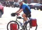 After a brief stop in Minneota, Stuart Stiffey of Woodstock, NY heads out of town to continue his 4,500-mile journey from Bristish Columbia, Canada, to his home in New York. 