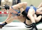 Teddy Pesch (left) took on two-time defending state champ Hunter Burnett of Pipestone Thursday. Pesch lost an 18-5 major decision but showed himself well against the defending champ.