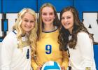 McKenzie Tolk, left, is the aunt of varsity teammate Emma Bottelberghe, right, and JV player Jordyn Tolk, center. Mascot photo by Brian Jeremiason