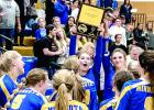 Morgan Hennen, with sister Abby by her side, held the Camden Conference Championship trophy after the Vikings beat MACCRAY.