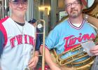 Joe Voit, left, and his father, John Voit performed the National Anthem with a 70-member Brass at Twins (BAT) band before a recent Minnesota Twins game at Target Field in Minneapolis.