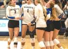 Minneota players celebrate after winning a set against Russell-Tyler-Ruthton last Thursday night in Tyler. 