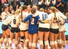 Minneota players console one another after falling to RTR in the Section 3A final Saturday.