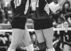 Minneota’s Leah Coequyt, left, and Jaylyn Coequyt team up to block an attack by Lac qui Parle Valley last Tuesday in Minneota. 