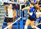 Leah Coequyt of Minneota, right, blasts a kill past a Central Minnesota Christian School defender last Tuesday in Minneota. 