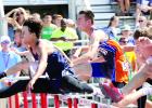 Carter Wente (center) ran the 110-meter hurdles at the state meet.