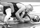 Adam DeVlaeminck, top, of Minneota went 4-0 at the Wabasso Duals on Saturday, pinning all four of his opponents at 139 and 145 pounds. 
