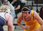Eli Gruenes, right, was Minneota's lone champion at the Delano Invitational on Saturday. Gruenes, wresting at 215, pinned all three of his opponents in the first period. 