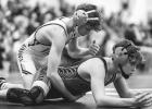 Heydan Danielson (top) of Minneota works on Quad County’s Henry Mathews before pinning him in their 114-pound match on Thursday. 