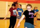 Captain Zoe DeBoer practiced a movement along with her teammates. 