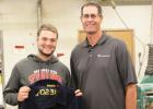 Ken Lanoue (right) of the Corn Growers Association made the presentation of the FFA jacket to Minneota President Grady Moorse. 